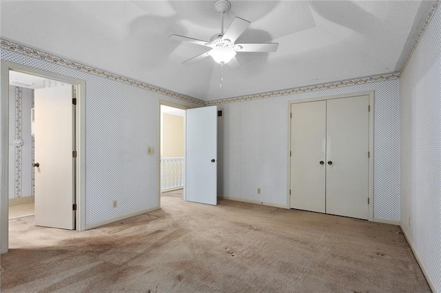 13220 W 76th St, Lenexa, KS 66216 - unfurnished bedroom featuring carpet floors, ensuite bathroom, and a ceiling fan