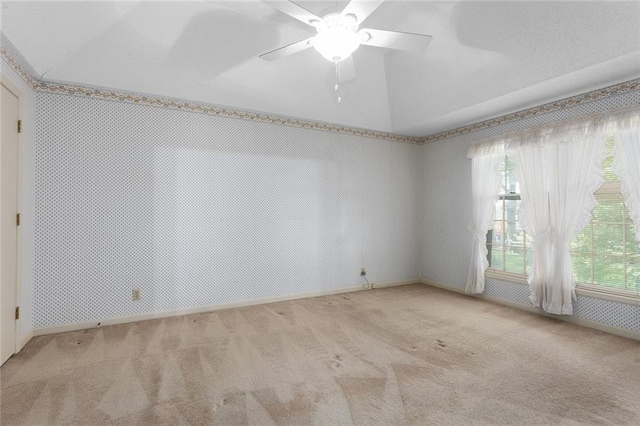13220 W 76th St, Lenexa, KS 66216 - carpeted spare room with vaulted ceiling and ceiling fan