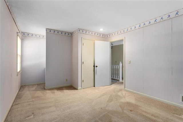 13220 W 76th St, Lenexa, KS 66216 - unfurnished room featuring carpet and a textured ceiling