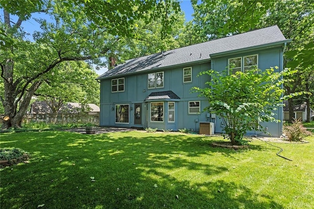 13220 W 76th St, Lenexa, KS 66216 - rear view of property with board and batten siding and a shingled roof