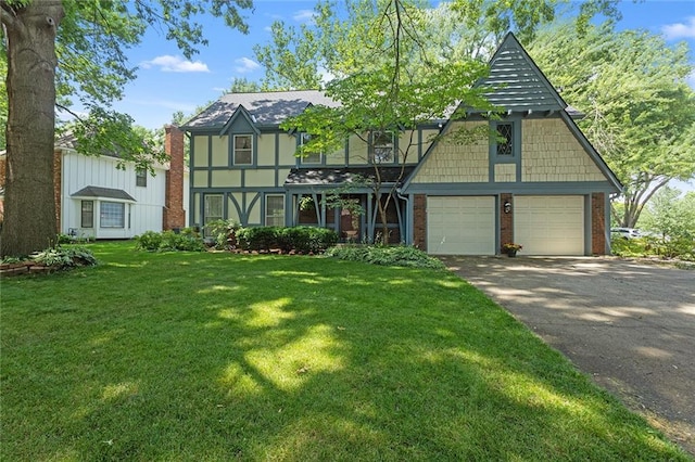 13220 W 76th St, Lenexa, KS 66216 - tudor home featuring brick siding, asphalt driveway, and a front yard