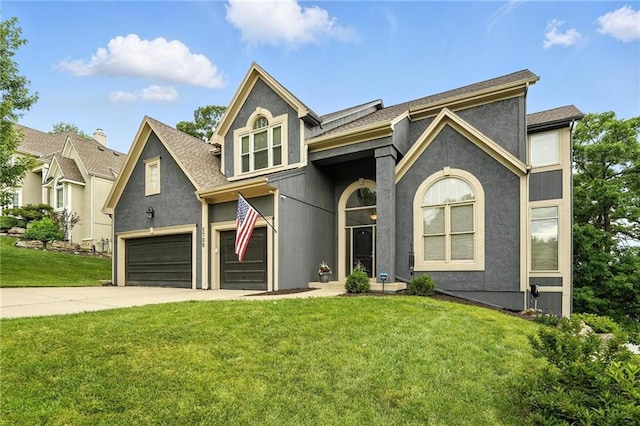 5708 Cottonwood St, Shawnee, KS 66216 - view of front facade featuring driveway, a front yard, a garage, a shingled roof, and stucco siding