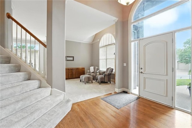 5708 Cottonwood St, Shawnee, KS 66216 - entrance foyer with wood finished floors, stairs, and high vaulted ceiling