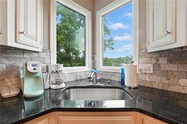 5708 Cottonwood St, Shawnee, KS 66216 - kitchen featuring white cabinets, dark stone countertops, and backsplash