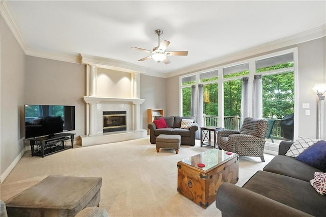 5708 Cottonwood St, Shawnee, KS 66216 - living room with crown molding, ceiling fan, carpet floors, and a glass covered fireplace