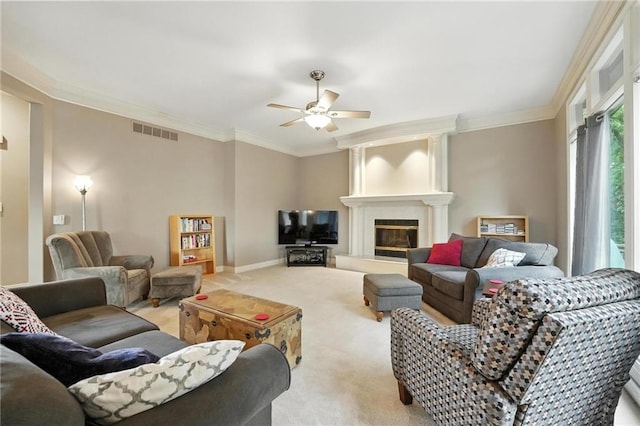 5708 Cottonwood St, Shawnee, KS 66216 - carpeted living area featuring a ceiling fan, crown molding, and a large fireplace