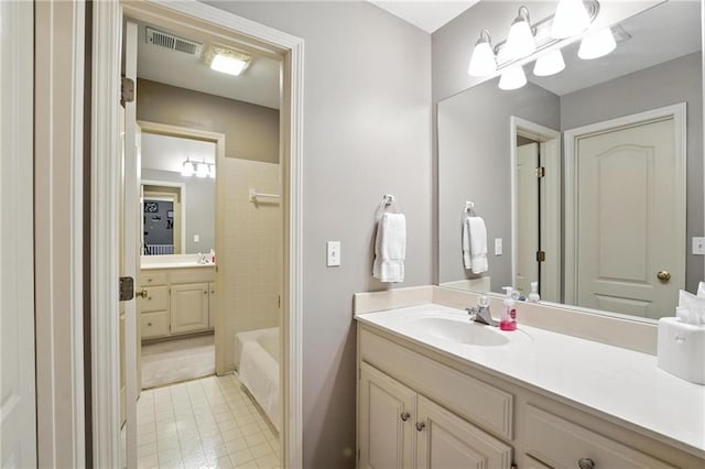 5708 Cottonwood St, Shawnee, KS 66216 - full bathroom featuring vanity, tile patterned flooring, and shower / bath combination