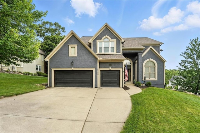5708 Cottonwood St, Shawnee, KS 66216 - view of front of property with a garage, concrete driveway, a front lawn, and stucco siding