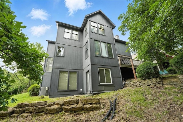 5708 Cottonwood St, Shawnee, KS 66216 - back of house with a wooden deck