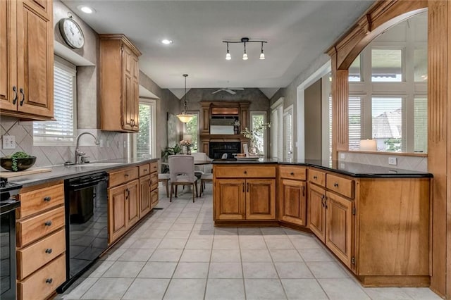 19326 W 98th St, Lenexa, KS 66220 - kitchen featuring dishwasher, tasteful backsplash, light tile patterned floors, dark countertops, and a fireplace