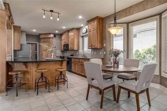 19326 W 98th St, Lenexa, KS 66220 - dining room featuring light tile patterned flooring and recessed lighting