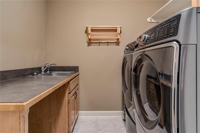 19326 W 98th St, Lenexa, KS 66220 - washroom with washer and dryer, light tile patterned floors, and cabinet space