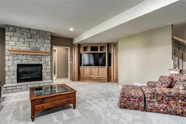 19326 W 98th St, Lenexa, KS 66220 - carpeted living area with a fireplace and recessed lighting