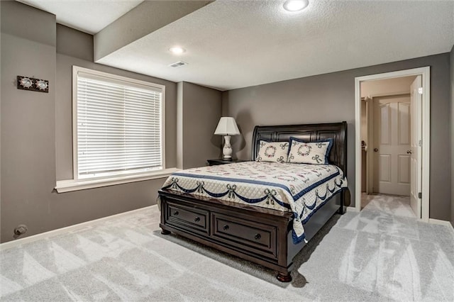 19326 W 98th St, Lenexa, KS 66220 - bedroom with carpet floors, a textured ceiling, and recessed lighting