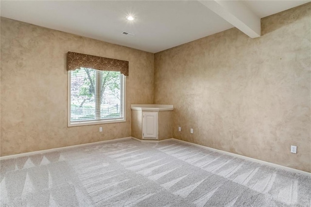 19326 W 98th St, Lenexa, KS 66220 - carpeted empty room with baseboards and beamed ceiling