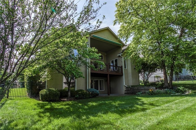 19326 W 98th St, Lenexa, KS 66220 - rear view of house with stucco siding and a balcony