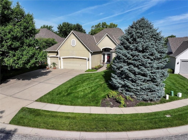 19326 W 98th St, Lenexa, KS 66220 - view of front of house with a garage, a front lawn, stucco siding, and driveway