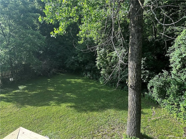 1411 NE 85th Ter, Kansas City, MO 64155 - view of yard with a wooded view