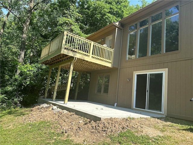 1411 NE 85th Ter, Kansas City, MO 64155 - rear view of property featuring a patio and a wooden deck