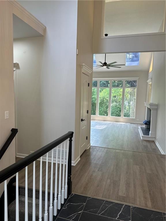 1411 NE 85th Ter, Kansas City, MO 64155 - hall with an upstairs landing, a high ceiling, and marble finish flooring