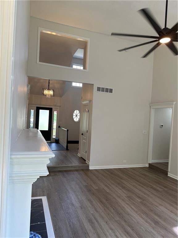 1411 NE 85th Ter, Kansas City, MO 64155 - foyer featuring a towering ceiling, a ceiling fan, dark wood finished floors, and a chandelier