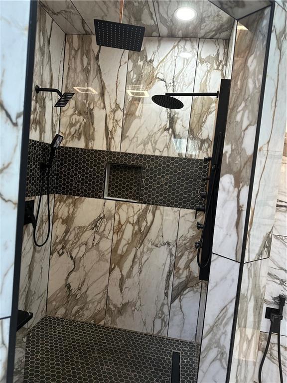 1411 NE 85th Ter, Kansas City, MO 64155 - bathroom view of a marble finish shower