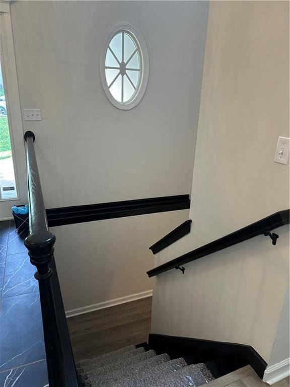 1411 NE 85th Ter, Kansas City, MO 64155 - staircase featuring baseboards