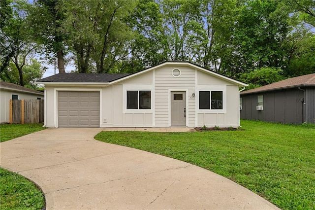 508 N Lincoln St, Olathe, KS 66061 - view of front of house with concrete driveway, a garage, and board and batten siding