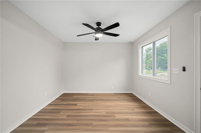 508 N Lincoln St, Olathe, KS 66061 - empty room with a ceiling fan and wood finished floors