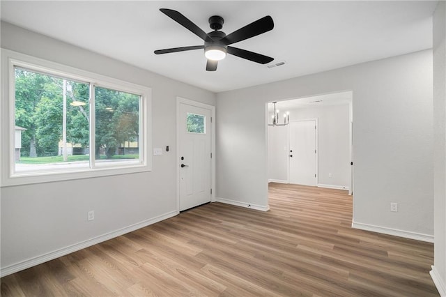508 N Lincoln St, Olathe, KS 66061 - entryway with a chandelier, light wood-type flooring, and ceiling fan