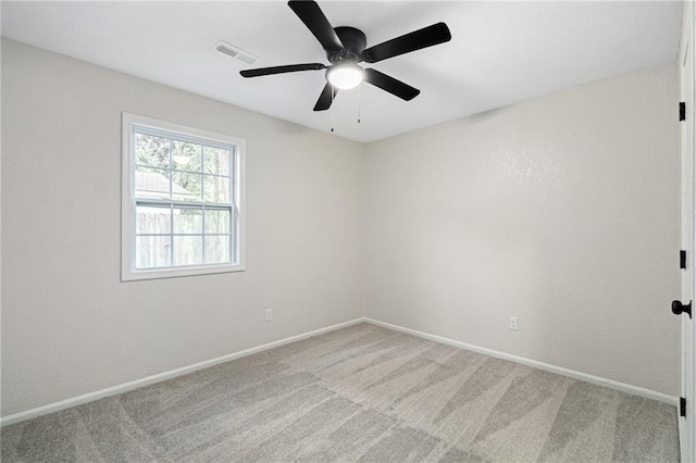508 N Lincoln St, Olathe, KS 66061 - carpeted spare room with baseboards and a ceiling fan