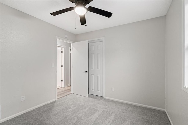 508 N Lincoln St, Olathe, KS 66061 - unfurnished bedroom featuring carpet, a closet, and a ceiling fan