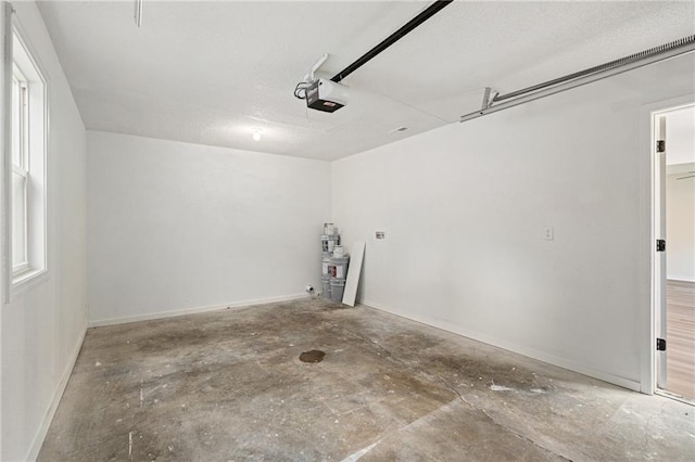 508 N Lincoln St, Olathe, KS 66061 - garage featuring a garage door opener and baseboards