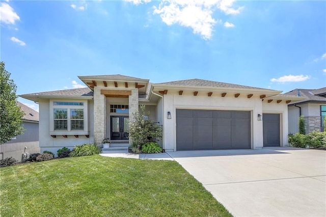 12605 W 169th St, Overland Park, KS 66221 - prairie-style house with a garage, driveway, a front yard, stucco siding, and french doors