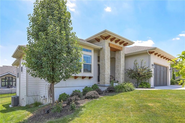 12605 W 169th St, Overland Park, KS 66221 - view of front of home featuring a garage, concrete driveway, and stucco siding