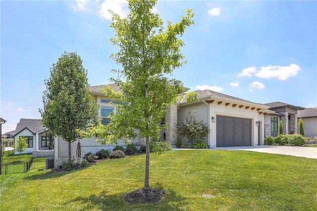 12605 W 169th St, Overland Park, KS 66221 - view of front of property featuring an attached garage, concrete driveway, and stucco siding