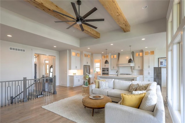 12605 W 169th St, Overland Park, KS 66221 - living area with light wood-style floors, beamed ceiling, recessed lighting, and ceiling fan
