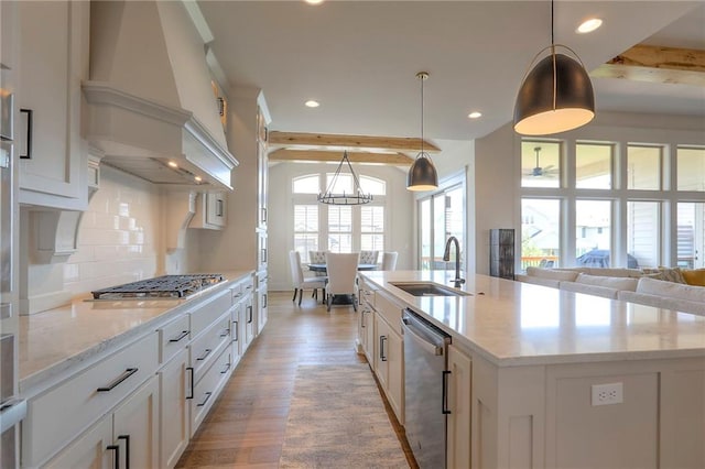 12605 W 169th St, Overland Park, KS 66221 - kitchen featuring stainless steel appliances, light wood-style flooring, recessed lighting, backsplash, and custom range hood