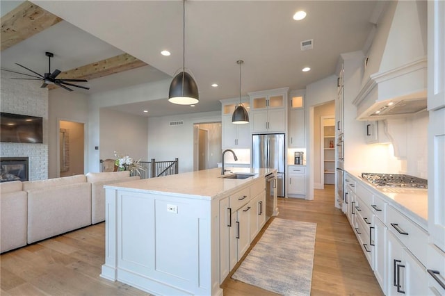 12605 W 169th St, Overland Park, KS 66221 - kitchen featuring stainless steel appliances, a ceiling fan, open floor plan, light wood-type flooring, and recessed lighting