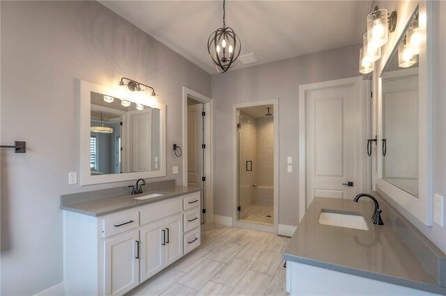 12605 W 169th St, Overland Park, KS 66221 - bathroom with a stall shower, two vanities, and a chandelier
