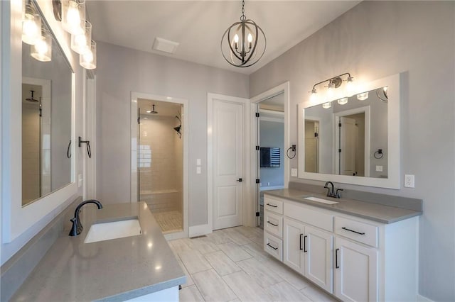12605 W 169th St, Overland Park, KS 66221 - bathroom with a chandelier, vanity, and a tile shower