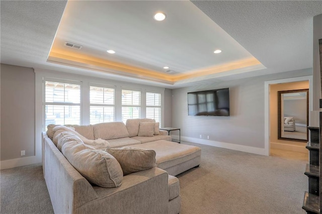 12605 W 169th St, Overland Park, KS 66221 - living area with a tray ceiling, carpet floors, and recessed lighting