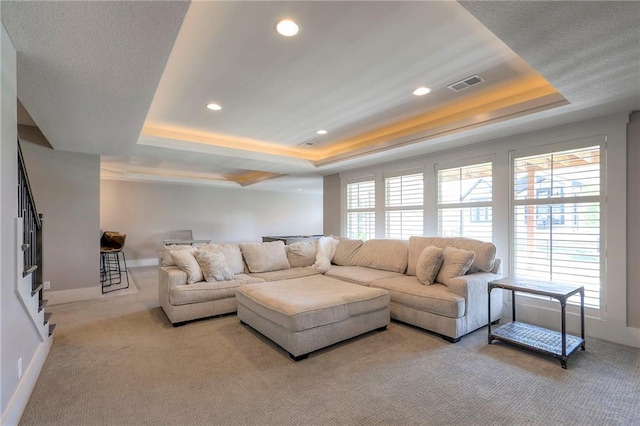 12605 W 169th St, Overland Park, KS 66221 - living room with a raised ceiling, light colored carpet, and recessed lighting
