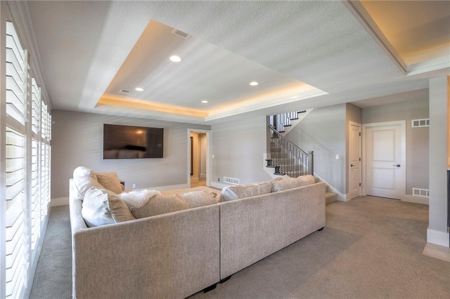 12605 W 169th St, Overland Park, KS 66221 - living area featuring a raised ceiling, stairs, carpet flooring, and recessed lighting