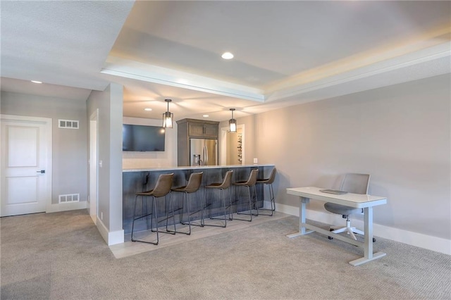 12605 W 169th St, Overland Park, KS 66221 - indoor bar featuring stainless steel fridge, a raised ceiling, carpet, recessed lighting, and hanging light fixtures
