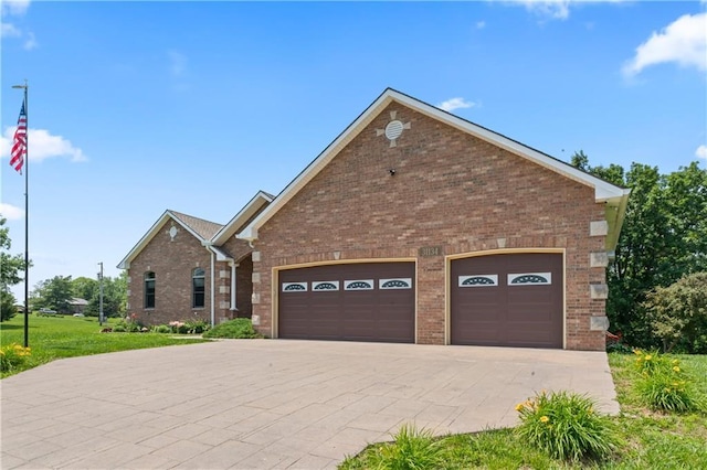31134 W 161st St, Excelsior Springs, MO 64024 - view of front of house with a garage, brick siding, driveway, and a front yard