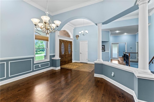 31134 W 161st St, Excelsior Springs, MO 64024 - foyer featuring a chandelier, wood finished floors, ornamental molding, and decorative columns