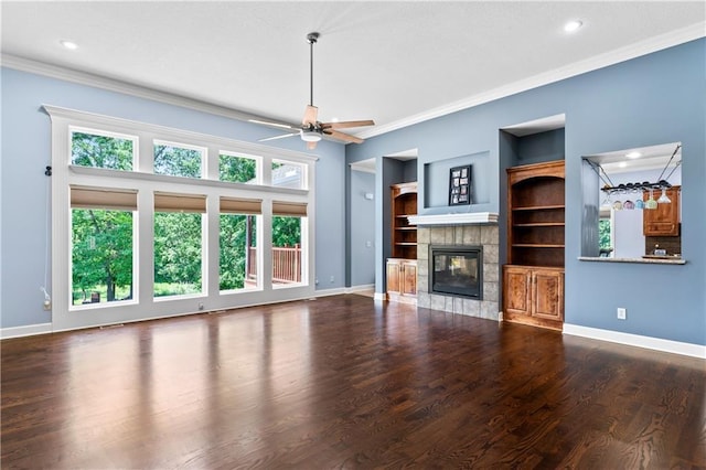 31134 W 161st St, Excelsior Springs, MO 64024 - unfurnished living room with ornamental molding, a ceiling fan, a fireplace, recessed lighting, and wood finished floors