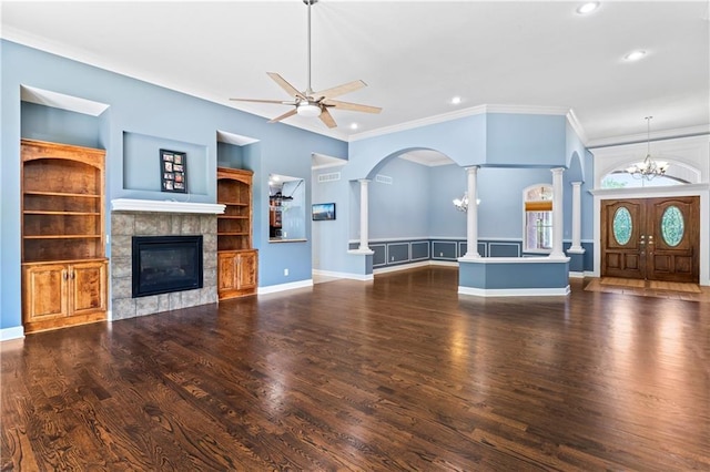 31134 W 161st St, Excelsior Springs, MO 64024 - unfurnished living room with decorative columns, a ceiling fan, arched walkways, recessed lighting, and a fireplace
