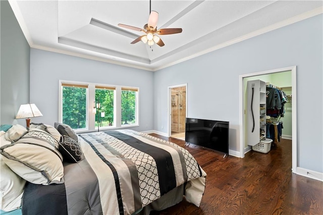 31134 W 161st St, Excelsior Springs, MO 64024 - bedroom with a raised ceiling, a walk in closet, wood finished floors, crown molding, and ensuite bath